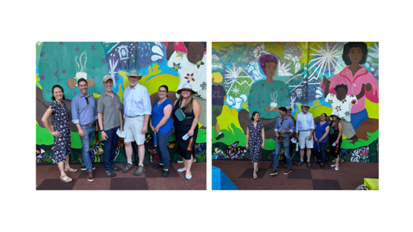 Legislators in front of community mural on climate resilience tour