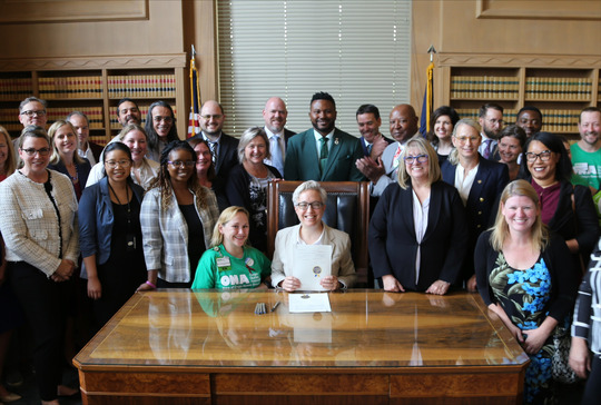 Gov Tina Kotek with Rep Nelson and others for the signing of HB 2697.