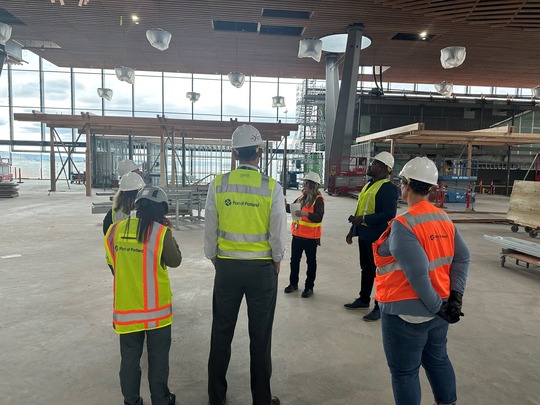 rep nelson with group of port of portland workers looking at construction