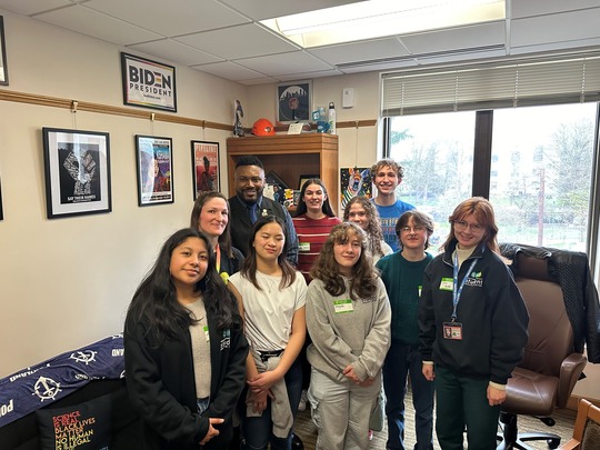 Representative Nelson takes a photo with student advocates from the Student Health Alliance