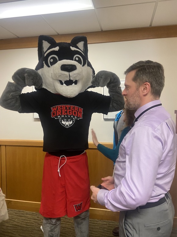 Legislative staff and University Mascot Wolf