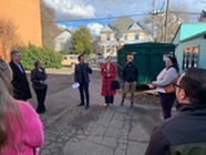 People standing outside on tour of PRISM location 
