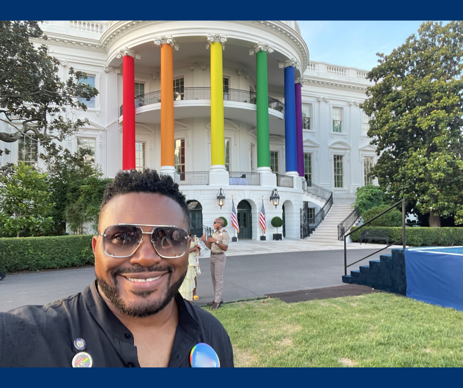 Rep Nelson standing in front of the White House with the columns different colors of the rainbow