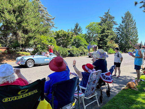 Rep Neron rides in the King City Parade on July 4th in a blue convertible