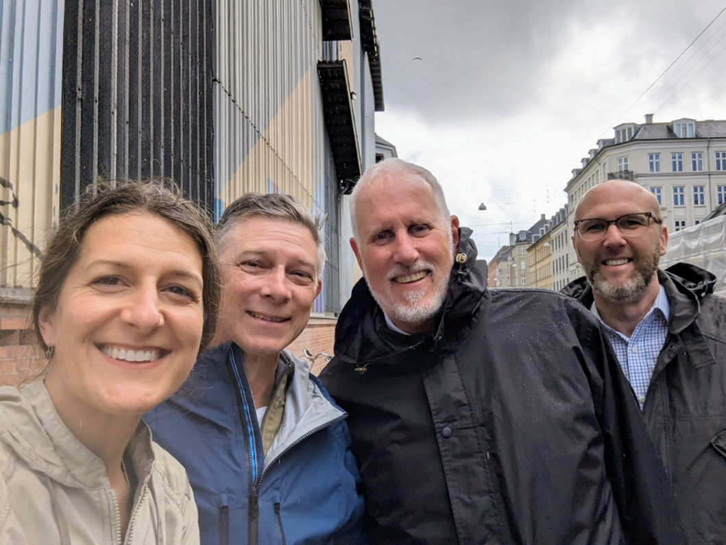 Rep Neron, Rep Helm, Rep Gamba, Bill Kent posing on a street in Denmark during the Waste Symbiosis Tour.