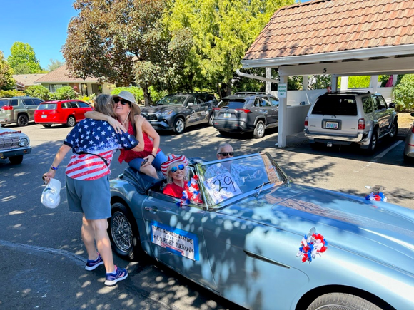Rep Neron hugging her friend's mom during the King City parade
