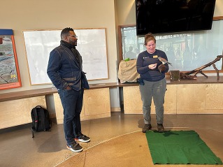 Rep Nelson standing next to bird at zoo event
