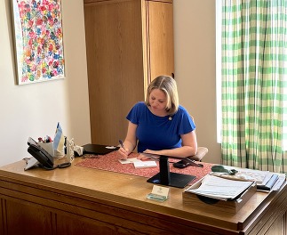 Rep. Levy signing documents 