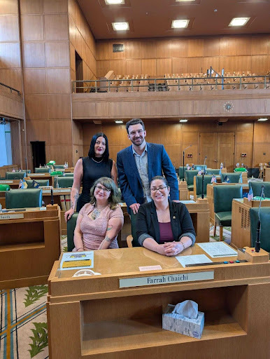 HD 35's Team. Rep. Chaichi and Anne Marie are seated at her legislative desk with staffers Sabbath and Zack standing behind.