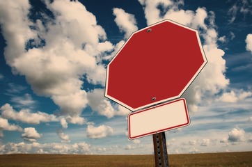 Stock photo of a stop sign and clouds