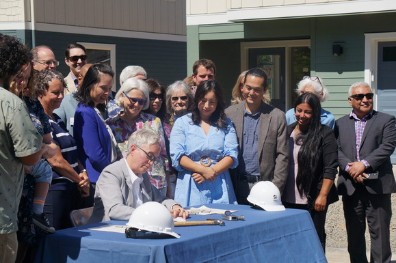 Governor Kotek signs new housing bills into law at a community ceremony in Hillsboro. Photo courtesy of Oregon Capital Chronicle.