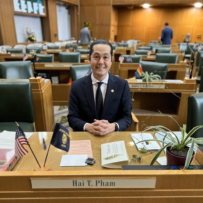Representative Pham at his desk on the House floor