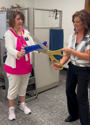 stacy and janice practicing ribbon cutting