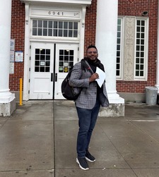 Rep Nelson in front of Roosevelt with a backpack on