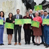 Legislators holding no cuts to transit signs