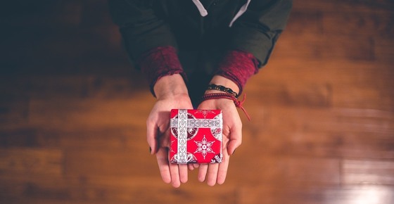 Photo of hands holding gift