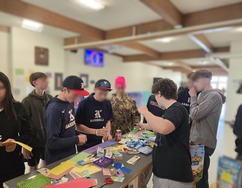 Images of the Mt Angel TAB Students passing out resources and talking to other students 