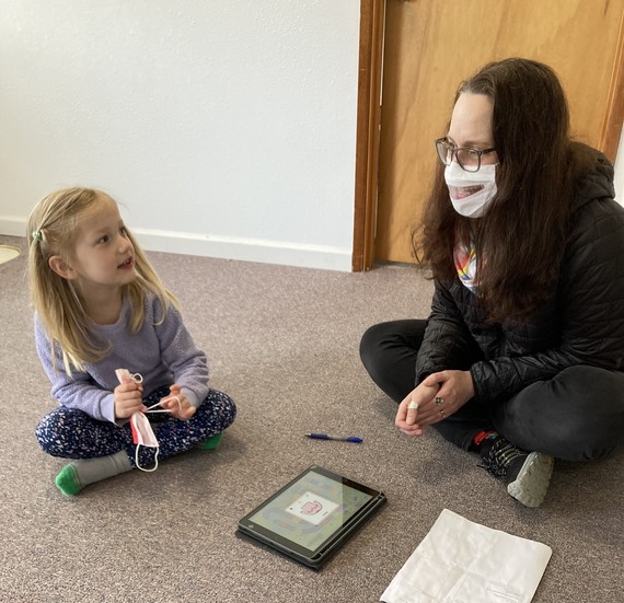 Iris Douglas works with a student