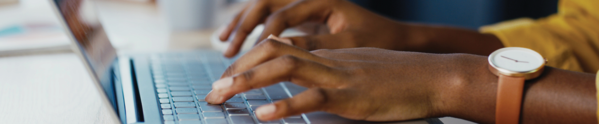 hands typing on keyboard