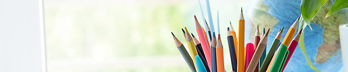 pencils with globe and window in the background