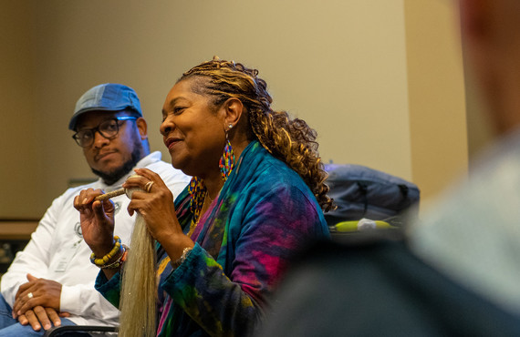 Rose McGee leads a story circle training as S.Z. Liwaru looks on