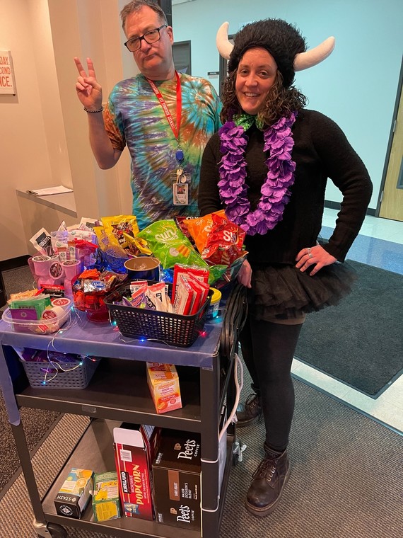 Jon Tannler and Cara Olson Sawyer pose for a photo in front of the snack cart