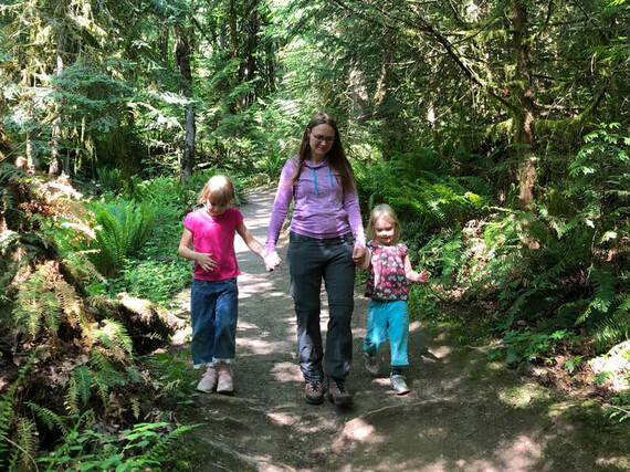 crystal greene walks with her daughters in forest park