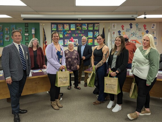 parent navigators and a child care provider pose for a photo with NWRESD board members and the superintendent