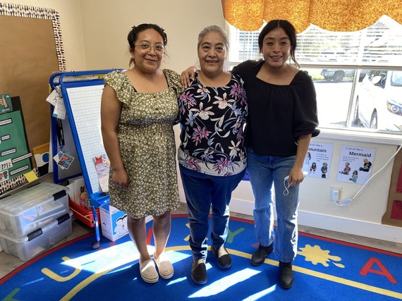 Sabi Velasco and her daughters Yesenia Flores and Saray Flores pose for a photo in their child care center