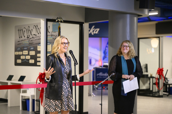 Raya Cadiz speaks to a crowd at the junior achievement discovery center