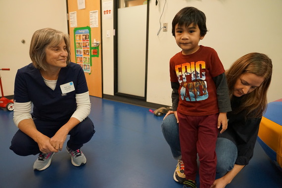 Rep. Lisa Reynolds poses for a photo with a student and a parent