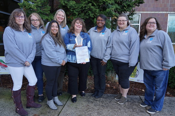 human resources team poses for a photo outside washington service center