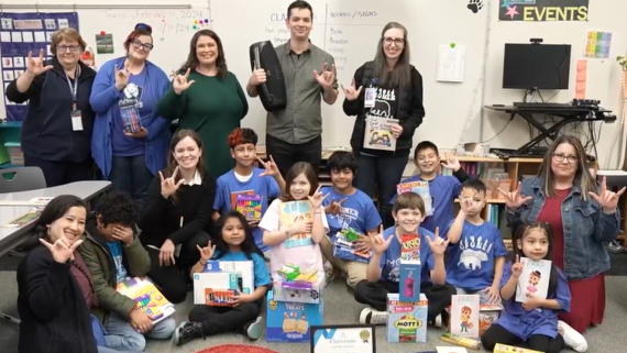 students and teachers sign i love you