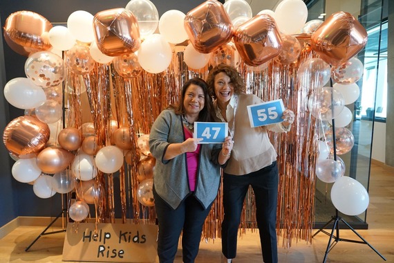 Northwest Regional ESD board members Becky Tymchuk and Maureen Wolf pose for a photo with their bidder numbers.