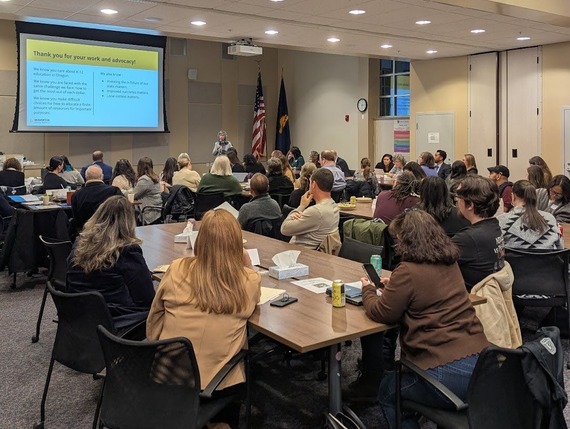 people gather in a conference room