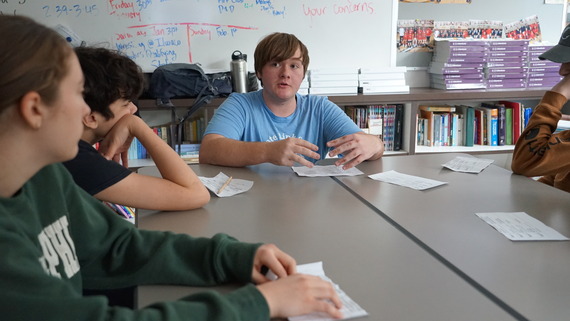 a student leads a class discussion