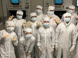group of student wearing cleanroom suits at Jireh tour