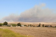 Photo by Jacob Powell of crops being burned by wildfire