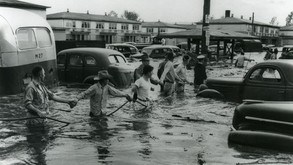 Citizens of Vanport, Oregon, hold on to a rope in the Vanport Flood