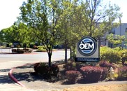 OEM Sign in front of new building