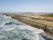 Waves crash along the South Jetty at Fort Stevens State Park in December