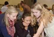 Three teenage girls work together on a FEMA project