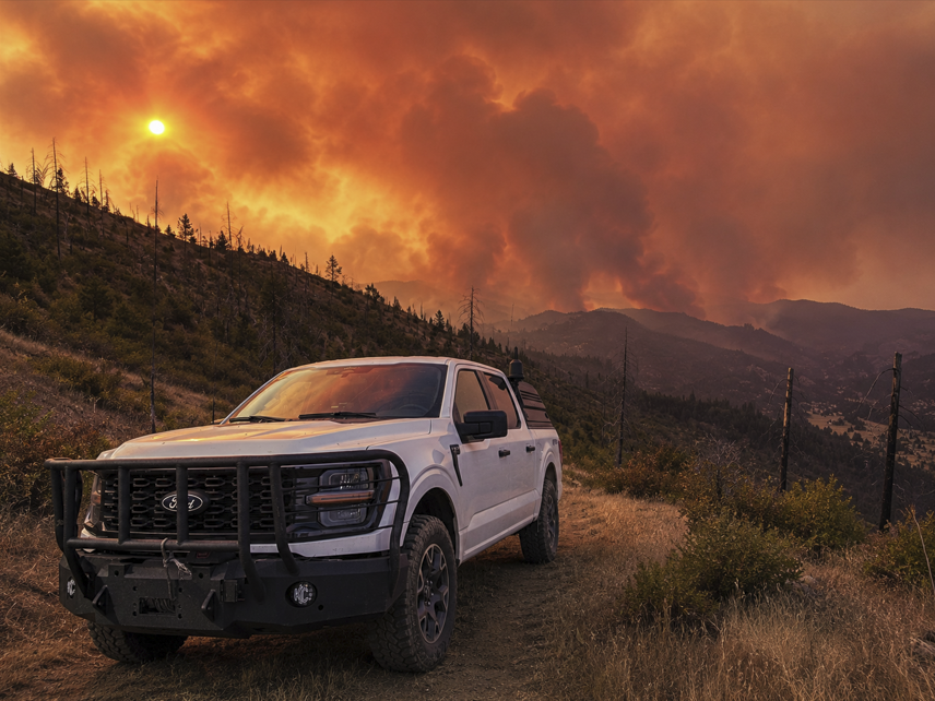 Photo taken of the East Evans Creek Road Fire by OEM Public Safety Communications Specialist, Jeff Perkins.