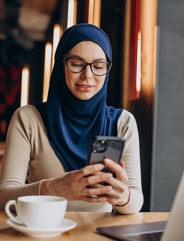 Stock image of woman working in coffee shop