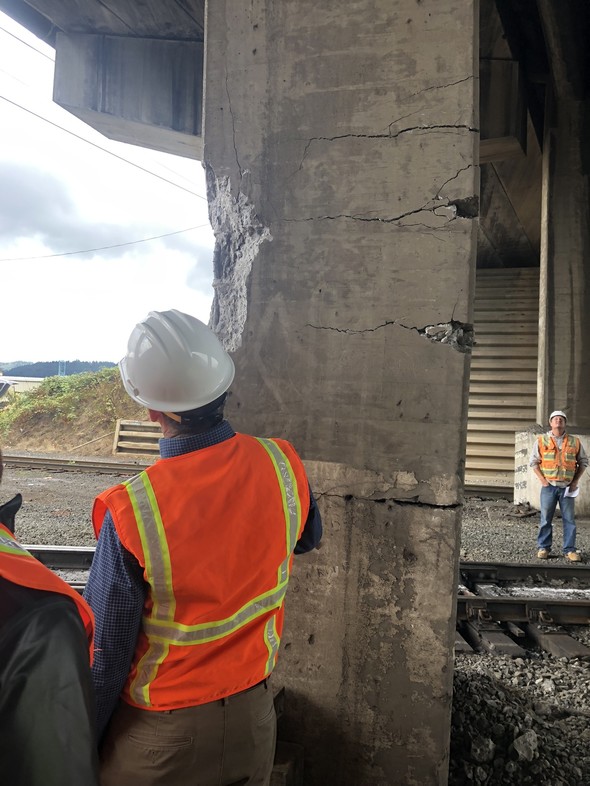 Engineers with Going Street Bridge column