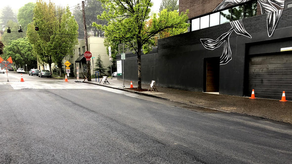 Freshly paved street segment on NW 25th