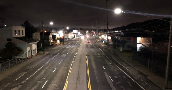 Lighting on both sides of wide streets, like in this photo of SE Division Street looking west of 85th Avenue, helps eliminate dark spots.