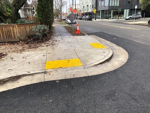 An image of a Portland intersection next to a home