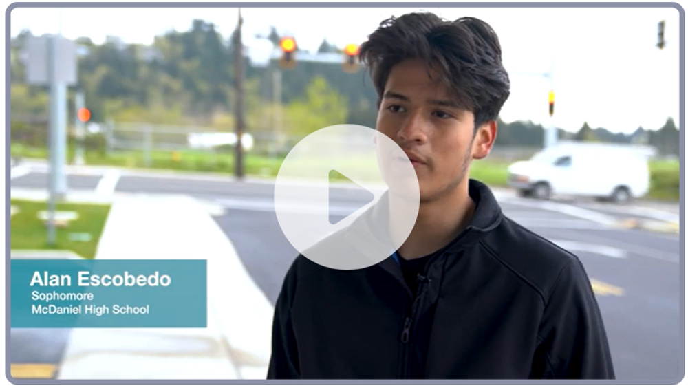 Image from the 82nd Avenue video with an image of student Alan Escobedo with button for linking to video