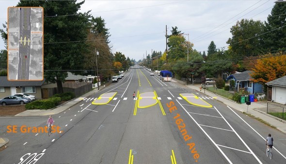 An image of one lane in each direction with a pedestrian crossing at SE 162nd Ave.